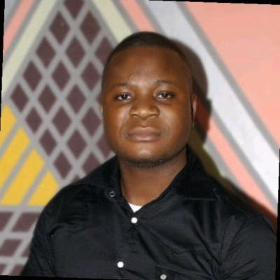 Person in black shirt, abstract background.