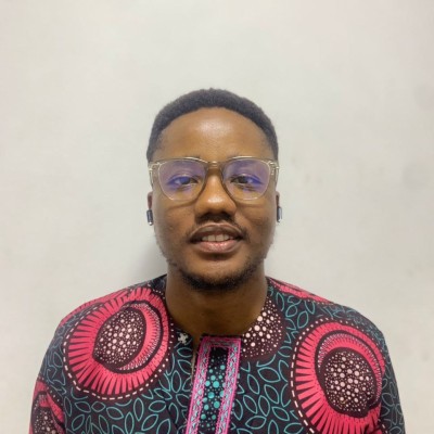 Person wearing colorful traditional attire.